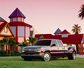 AUT 14 RK0867 04
2003 Chevrolet Dually Custom Paint Low 3/4 Front View On Grass By House And Palm Trees Filtered