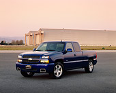 AUT 14 RK0893 04
2004 Chevrolet SS 1500 Extended Cab Blue 3/4 Front View On Pavement Airplane Hanger Background Pink Sky