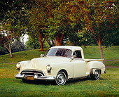 AUT 14 RK0994 01
1949 Oldsmobile Pickup Truck Beige 3/4 Front View On Grass By Trees