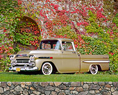 AUT 14 RK1003 02
1959 Chevrolet Apache Pick Up Truck Gold 3/4 Side View On Grass By Ivy Covered Wall