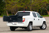 AUT 14 RK1046 01
2006 Honda Ridgeline White Truck 3/4 Rear View Rear Door Open On Pavement
