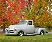 AUT 14 RK1056 03
1954 Chevy 3100 1/2 Ton Custom Pick Up Truck Silver 3/4 Side View On Grass By Autumn Trees
