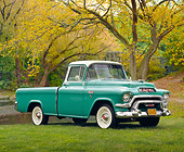 AUT 14 RK1072 02
1956 GMC Suburban Pick Up Truck Green And White 3/4 Side View On Grass By Pond And Trees