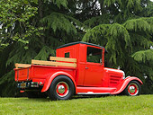 AUT 14 RK1143 01
1928 Ford Model A Pick Up Truck Orange 3/4 Rear View On Grass By Trees