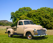 AUT 14 RK1158 01
1951 GMC 100 Pick Up Truck Sand 3/4 Side View On Grass By Trees
