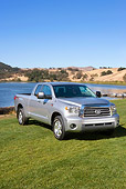 AUT 14 RK1240 01
2007 Toyota Tundra Double Cab Limited TRD Slate 3/4 Front View On Grass By Lake And Hills