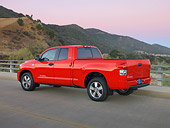 AUT 14 RK1244 01
2007 Toyota Tundra Double Cab SR5 Red 3/4 Rear View On Pavement By Hills At Dusk