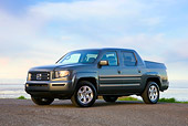 AUT 14 RK1356 01
2008 Honda Ridgeline RTS Gray 3/4 Front View On Dirt By Water