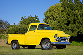 AUT 14 RK1414 01
1957 Chevrolet Pickup Truck Yellow 3/4 Front View On Grass By Trees