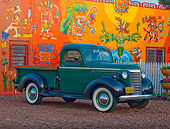 AUT 14 RK1525 01
1940 Chevrolet Pickup Truck Green 3/4 Front View On Pavement By Colorful Building