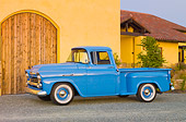 AUT 14 RK1538 01
1958 Chevrolet Apache Pickup Truck Blue 3/4 Front View On Gravel By Building