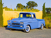 AUT 14 RK1540 01
1958 Chevrolet Apache Pickup Truck Blue 3/4 Front View On Gravel By Wall