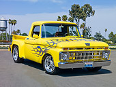 AUT 14 RK1546 01
1965 Ford F-100 Stepside Pickup Truck Yellow 3/4 Front View On Pavement