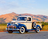 AUT 14 RK1551 01
1946 Chevrolet 1/2 Ton Pickup Truck White And Blue 3/4 Front View On Pavement By Hills