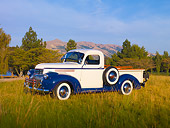 AUT 14 RK1553 01
1946 Chevrolet 1/2 Ton Pickup Truck White And Blue 3/4 Front View On Grass By Hills