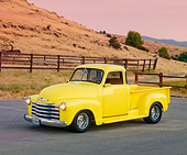 AUT 14 RK1558 01
1950 Chevrolet Pickup Truck Yellow 3/4 Front View On Pavement By Hills