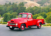 AUT 14 RK1559 01
1954 International R110 Heavy Duty 1/2 Ton Pickup Truck Red 3/4 Front View On Pavement By Trees And Hills