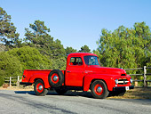 AUT 14 RK1562 01
1954 International R110 Heavy Duty 1/2 Ton Pickup Truck Red 3/4 Front View On Pavement By Trees