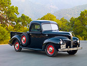 AUT 14 RK1565 01
1941 Ford 1/2 Ton Pickup Truck Black 3/4 Front View On Pavement By Trees And Hills