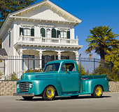 AUT 14 RK1577 01
1950 Ford F1 Pickup Truck Green 3/4 Front View On Pavement By House