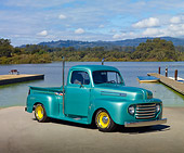 AUT 14 RK1580 01
1950 Ford F1 Pickup Truck Green 3/4 Front View On Pavement By Lake
