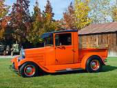 AUT 14 RK1599 01
1928 Ford Model A Pickup Truck Orange 3/4 Front View On Grass By Barn