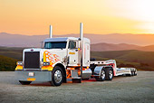 AUT 14 RK1615 01
1991 Peterbilt Semi White With Orange And Yellow Flames 3/4 Front View On Pavement By Sunset