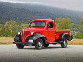 AUT 14 RK1619 01
1939 Plymouth PT-81 Pickup Truck Red And Black 3/4 Front View On Pavement By Trees And Fog