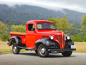 AUT 14 RK1620 01
1939 Plymouth PT-81 Pickup Truck Red And Black 3/4 Front View On Pavement By Trees And Fog