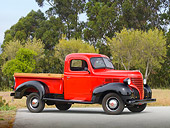 AUT 14 RK1623 01
1939 Plymouth PT-81 Pickup Truck Red And Black 3/4 Side View On Pavement By Trees And Fog