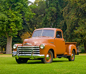 AUT 14 RK1625 01
1949 Chevrolet 3100 Pickup Truck Brown 3/4 Front View On Grass By Trees