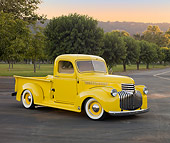 AUT 14 RK1629 01
1941 Chevrolet Pickup Truck Yellow 3/4 Front View On Pavement By Grass And Trees