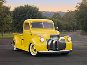 AUT 14 RK1630 01
1941 Chevrolet Pickup Truck Yellow 3/4 Front View On Pavement By Grass And Trees