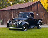 AUT 14 RK1638 01
1946 Chevrolet Pickup Truck Black 3/4 Front View On Grass By Shed