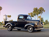 AUT 14 RK1641 01
1946 Chevrolet Pickup Truck Black 3/4 Side View On Pavement By Trees And Water Tower