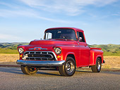 AUT 14 RK1652 01
1957 Chevrolet 1/2 Ton Pickup Truck Red 3/4 Front View On Pavement By Field And Trees