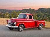 AUT 14 RK1658 01
1957 Chevrolet 1/2 Ton Pickup Truck Red 3/4 Side View On Pavement By Field And Trees