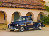 AUT 14 RK1662 01
1948 Chevrolet 1/2 Ton Pickup Truck Black Currant 3/4 Front View On Pavement By Building