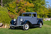 AUT 14 RK1671 01
1935 Reo Speedwagon GAP Pickup Truck Gray And Black 3/4 Front View On Grass By Trees