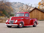 AUT 14 RK1677 01
1941 Ford Pickup Truck Red 3/4 Front View On Pavement By Wooden Shed And Trees