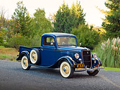 AUT 14 RK1682 01
1935 Ford 1/2 Ton Pickup Truck Blue Over Black 3/4 Front View On Pavement By Trees