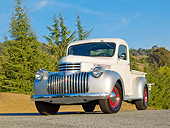 AUT 14 RK1723 01
1941 Chevrolet Pickup White And Silver 3/4 Front View On Pavement By Evergreen Trees