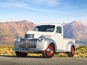 AUT 14 RK1724 01
1941 Chevrolet Pickup White And Silver 3/4 Front View On Pavement By Evergreen Trees