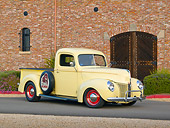 AUT 14 RK1730 01
1941 Ford Pickup Yellow 3/4 Front View On Pavement By Brick Building