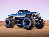 AUT 14 RK1739 01
2011 Dodge Ram Monster Truck Black With Blue Flames 3/4 Front View On Sand