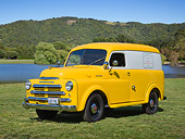 AUT 14 RK1752 01
1948 Dodge Panel Truck Yellow With White Stripe 3/4 Front View On Grass By Pond