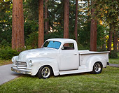 AUT 14 RK1754 01
1951 GMC Pickup Gray With Ghost Flames 3/4 Side View On Grass By Redwoods