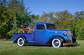 AUT 14 RK1757 01
1937 Chevrolet Pickup Blue And Black With Bicycles 3/4 Side View On Grass By Trees