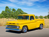 AUT 14 RK1767 01
1966 Chevrolet C-10 Pickup Yellow 3/4 Front View On Pavement By Field And Trees