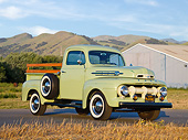 AUT 14 RK1769 01
1952 Ford F-1 Pickup Glen Mist Green 3/4 Front View On Pavement By Shed And Grassy Hills